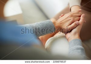 stock-photo-close-up-of-psychiatrist-hands-together-holding-palm-of-her-patient-229879537