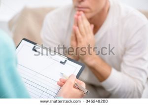 stock-photo-tell-me-about-your-problem-close-up-of-folder-in-hands-of-professional-psychologist-holding-it-and-345249200