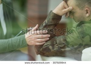 stock-photo-young-soldier-suffering-from-depression-after-war-307929944